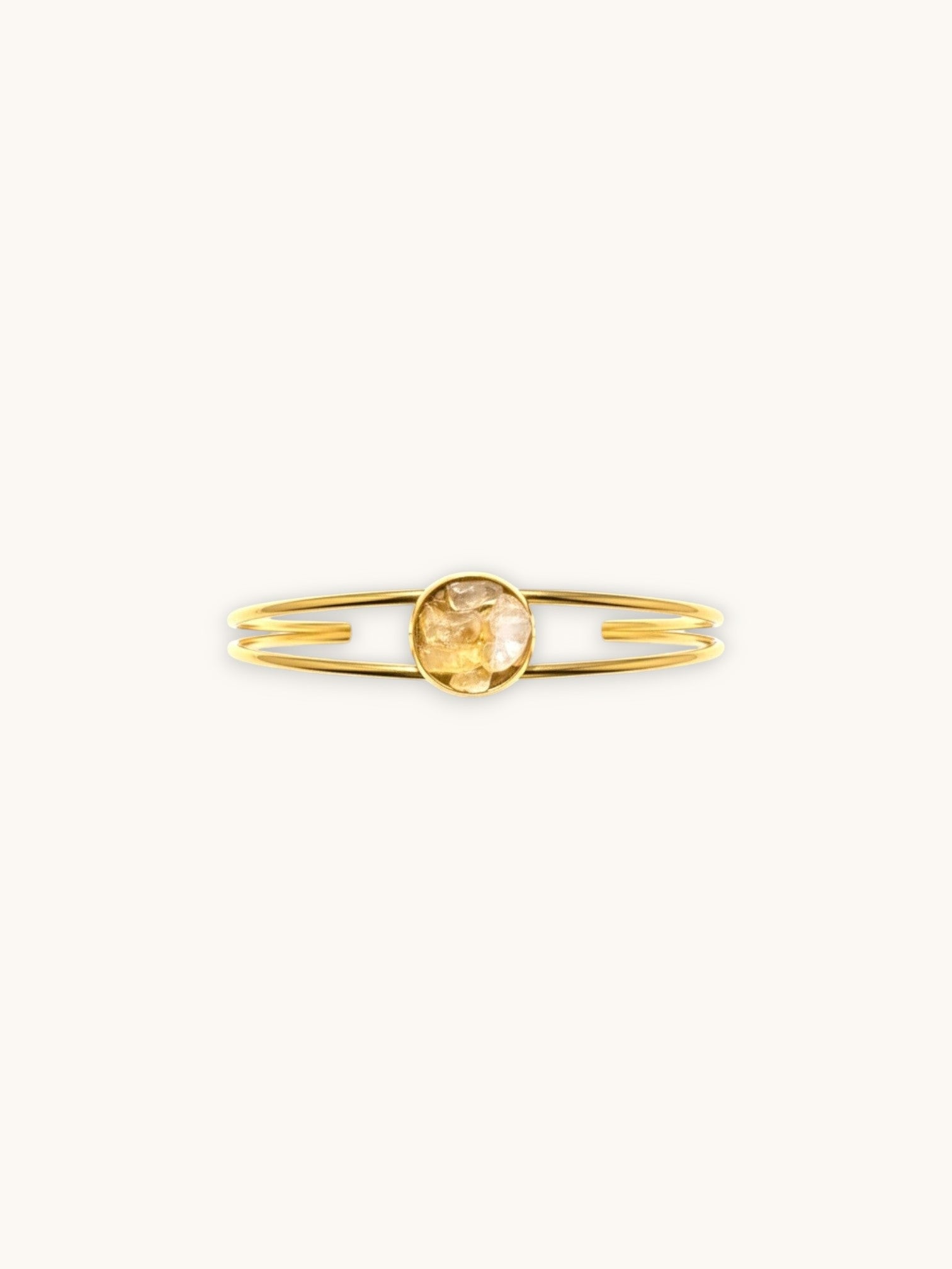 Citrinmagi dubbelt armband i 18k guldpläterat stål med en naturlig citrinkristall i en elegant bågdesign.