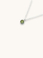 Citrinmagi halsband med rund berlock och äkta grön peridotkristall i silverpläterat rostfritt stål