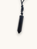 Citrinmagi handgjort halsband med en pendelformad äkta svart obsidian och ett justerbart svart textilband.